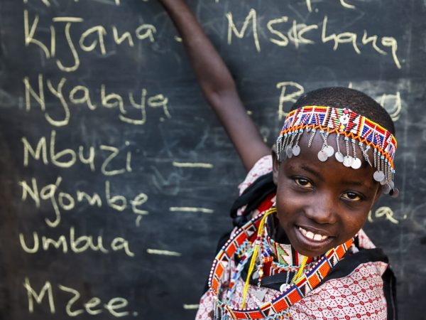 little african girl during swahili language class, east africa