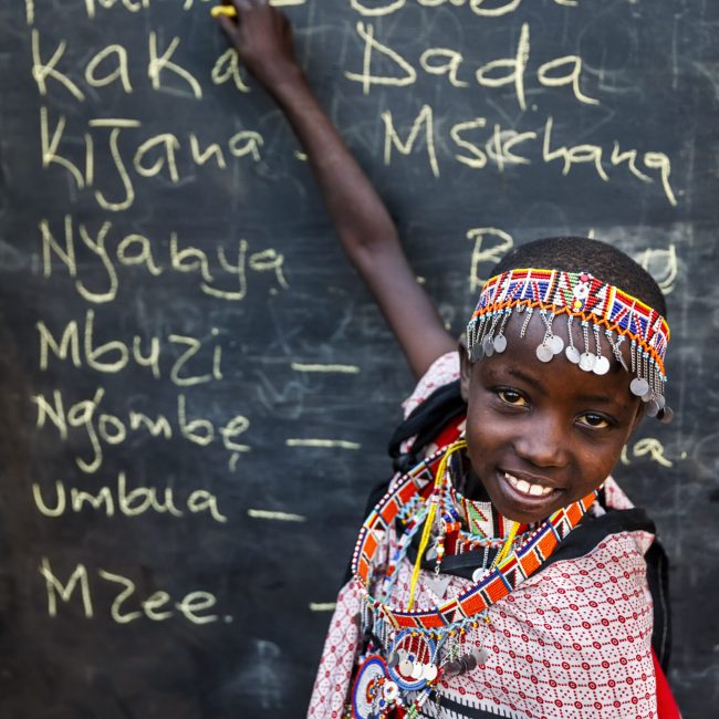 little african girl during swahili language class, east africa